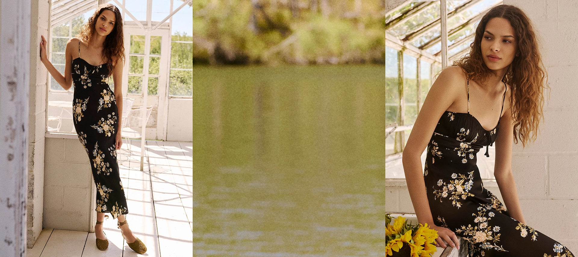 A woman in a floral dress stands in a sunlit room with a body of water in the background.