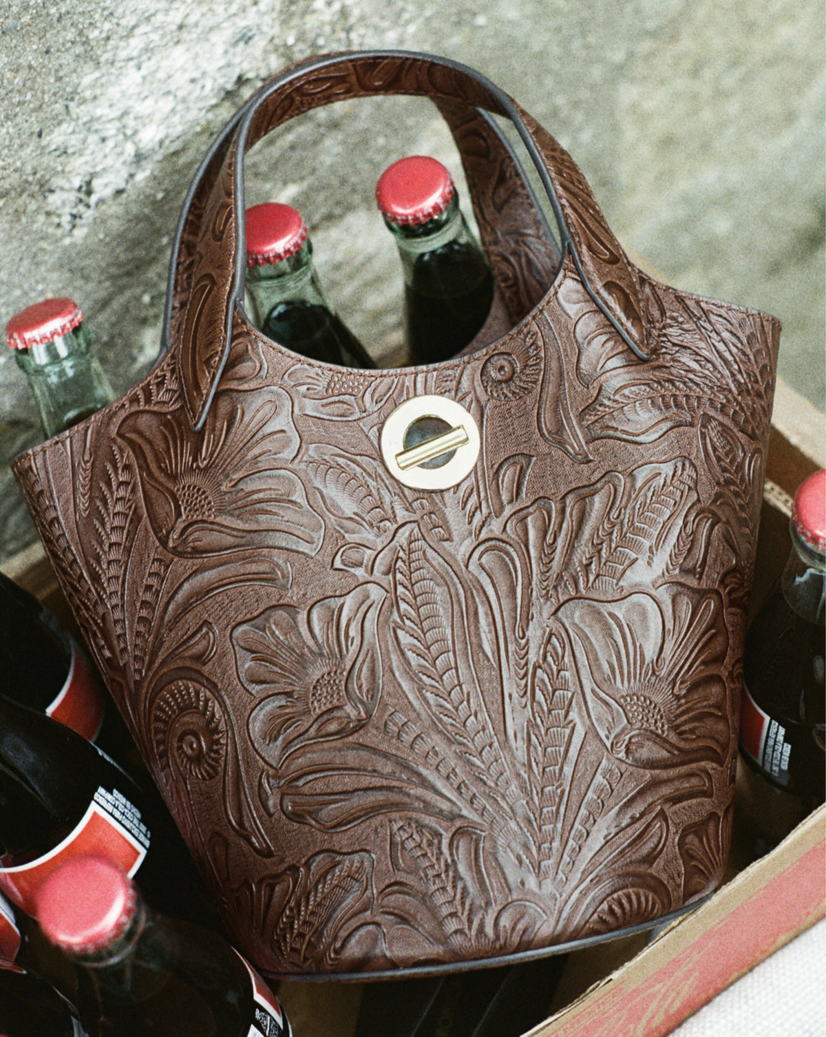 Veronica Beard Brown embossed leather bucket bag with silver hardware.