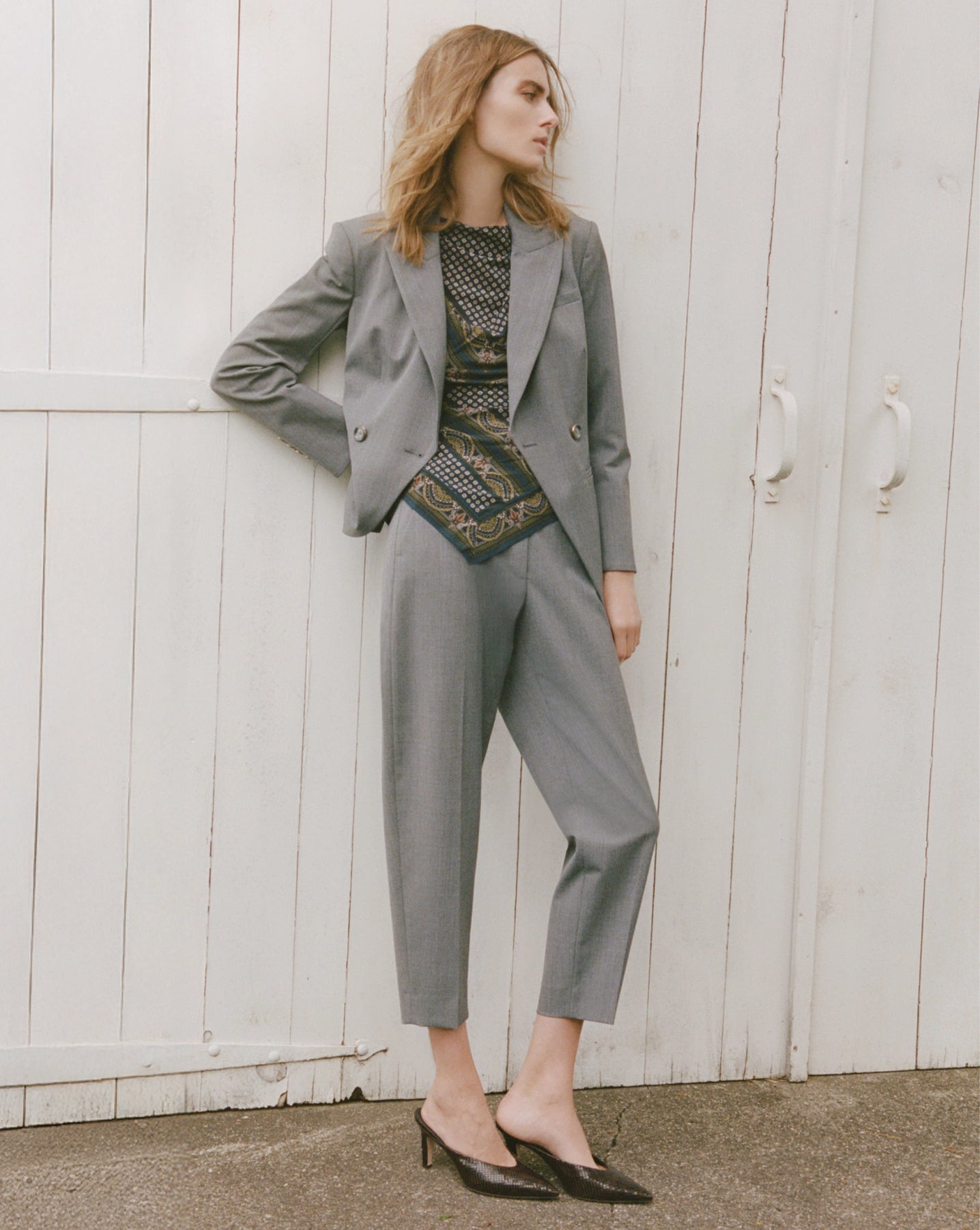 Veronica Beard Gray wool trousers, high-waisted, straight-leg, with single button closure.