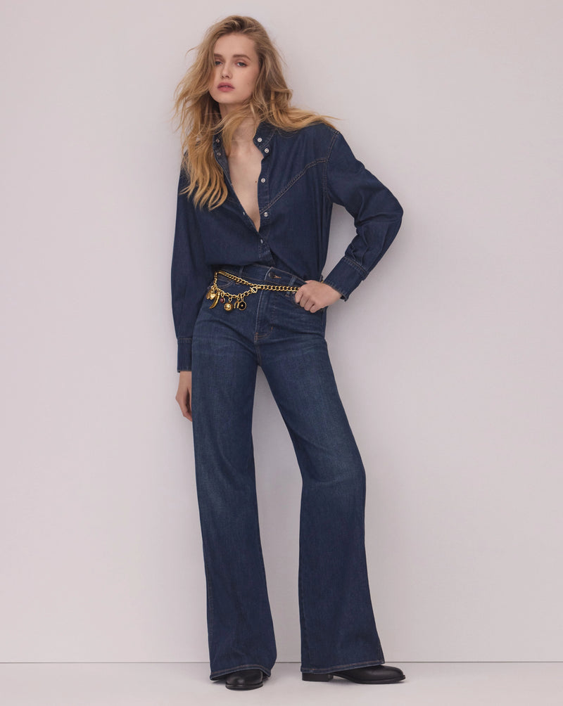 Veronica Beard Blue denim shirt with a pussy-bow collar.
