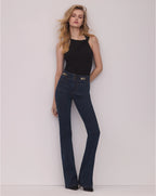 Veronica Beard Black ribbed knit top with pearl button detail.