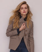 Veronica Beard Brown houndstooth suit with double-breasted blazer and cropped pants.