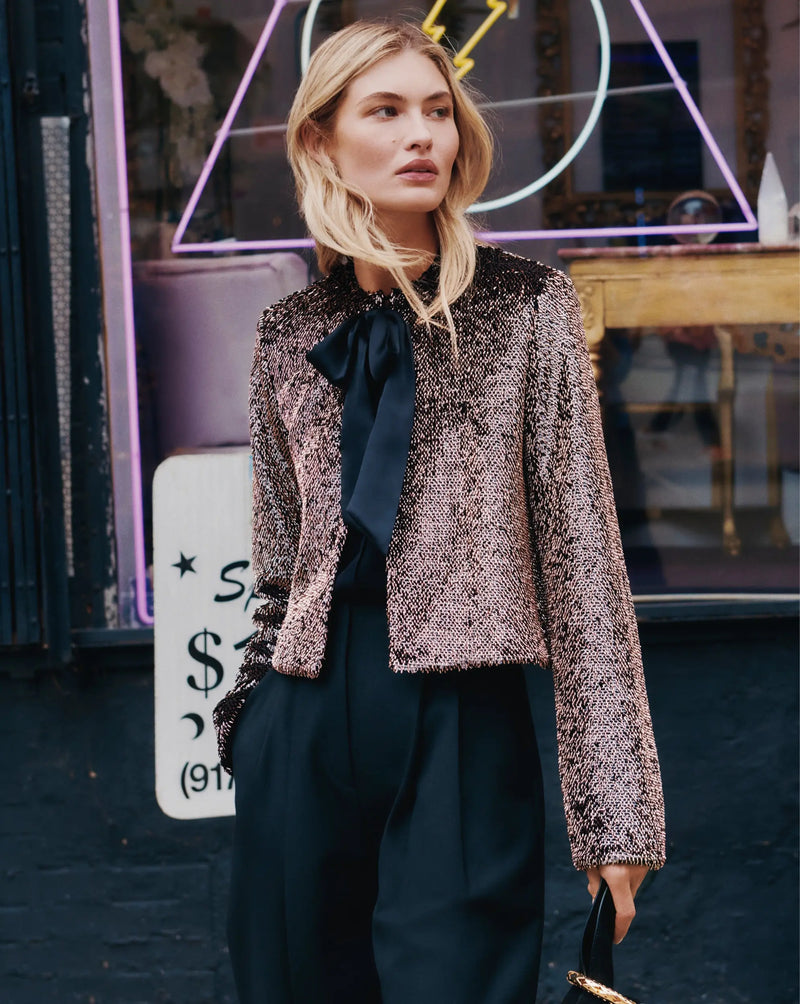 Veronica Beard Brown sequin cropped jacket and black trousers.