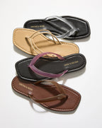 Veronica Beard Beige flat thong sandals with clear PVC straps.