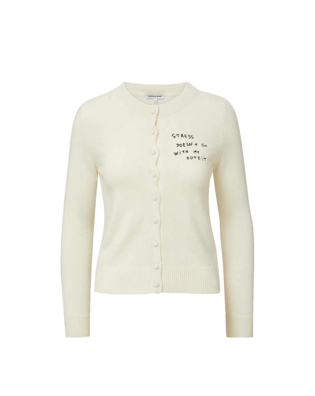 Veronica Beard Cream knit cardigan with "Stress doesn't go with my outfit" embroidered on the chest.