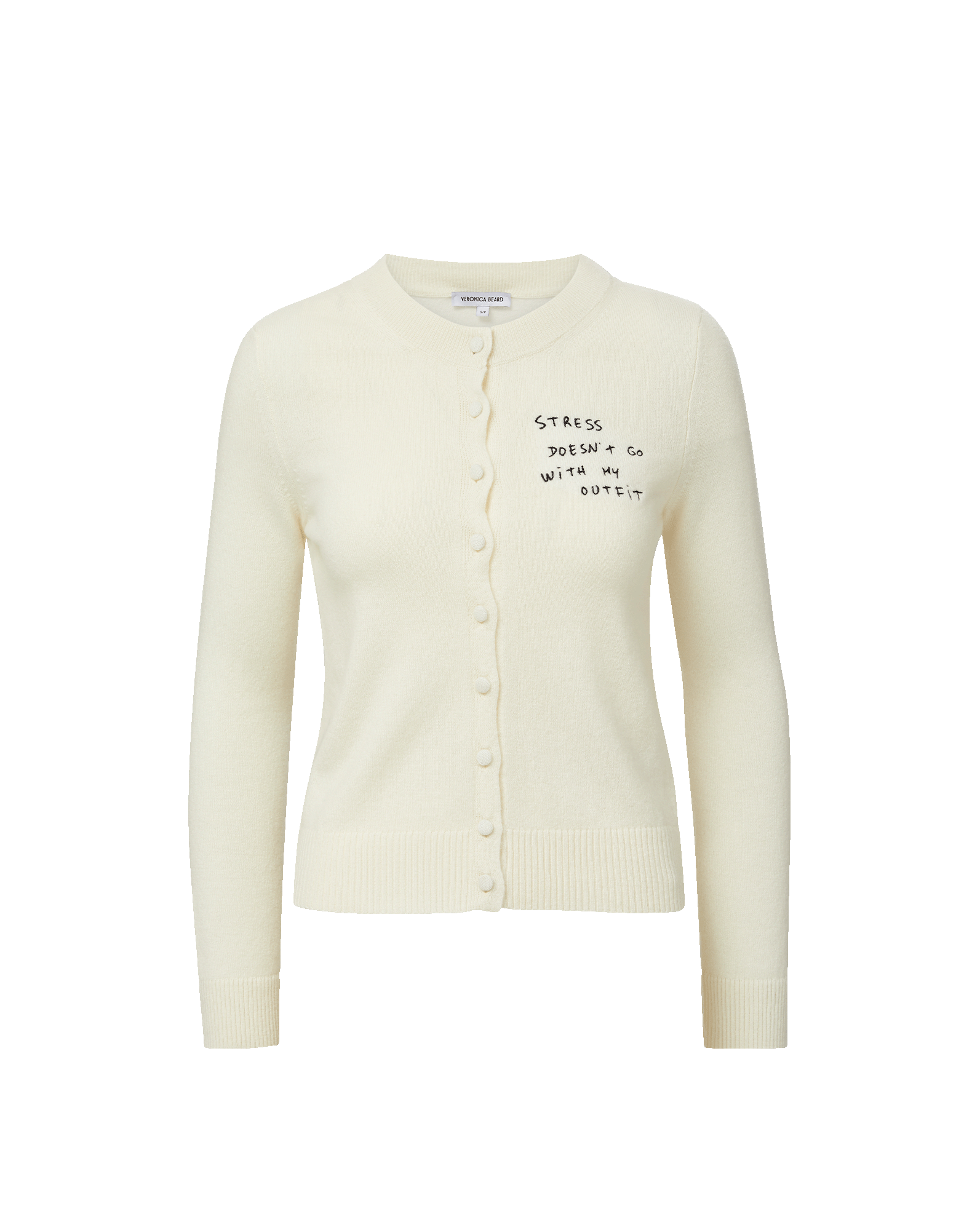 Veronica Beard Cream knit cardigan with "Stress doesn't go with my outfit" embroidered on the chest.