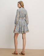 Veronica Beard Light blue floral print mini dress with long sleeves, a collared neckline, and a cinched waist.
