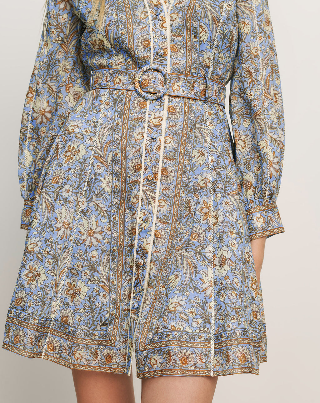 Veronica Beard Light blue floral print mini dress with a belted waist and long sleeves.