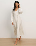 Veronica Beard Cream-colored midi wrap dress with voluminous sleeves and a matching belt.