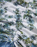 Veronica Beard White ruched swimsuit with blue and green floral print.