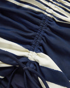 Veronica Beard Navy and white striped ruched dress with a drawstring tie.
