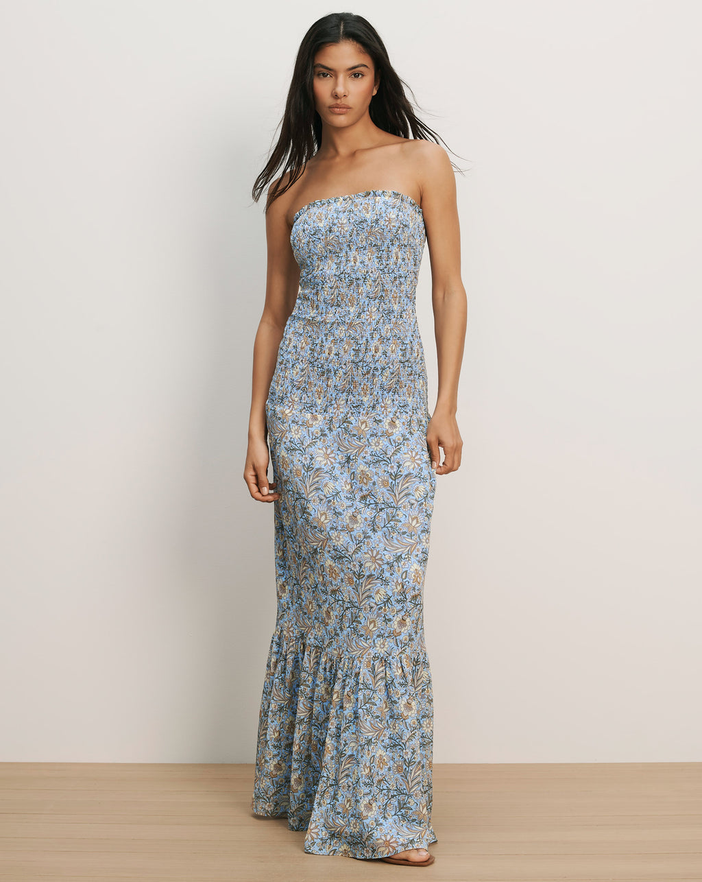 Veronica Beard Light blue floral smocked strapless maxi dress with a ruffled hem.