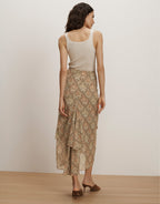 Veronica Beard Ribbed cream tank top and a flowing beige paisley print tiered midi skirt.