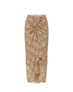Veronica Beard Ribbed cream tank top and a sheer, ruched midi skirt with a beige paisley print and a matching belt.