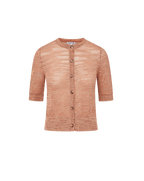Veronica Beard Coral textured knit cardigan with short sleeves and light wash denim shorts.