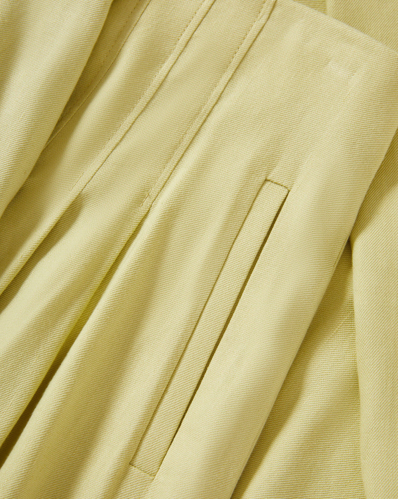 Veronica Beard Light green satin camisole with lace trim and matching wide-leg pleated trousers.