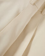Veronica Beard Beige pleated trousers with a subtle texture.