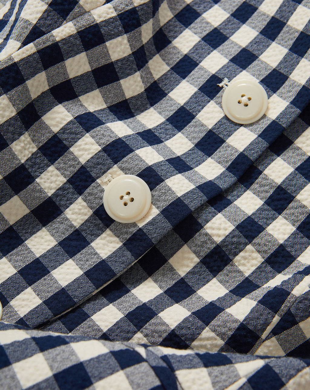 Veronica Beard Navy and white gingham vest with cream buttons.