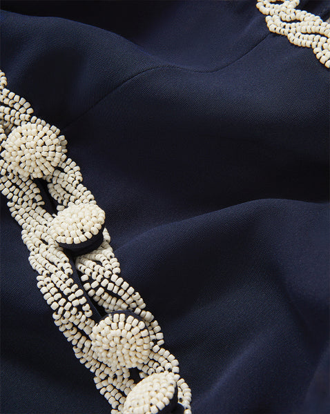 Veronica Beard Navy blue dress with cream beaded trim.