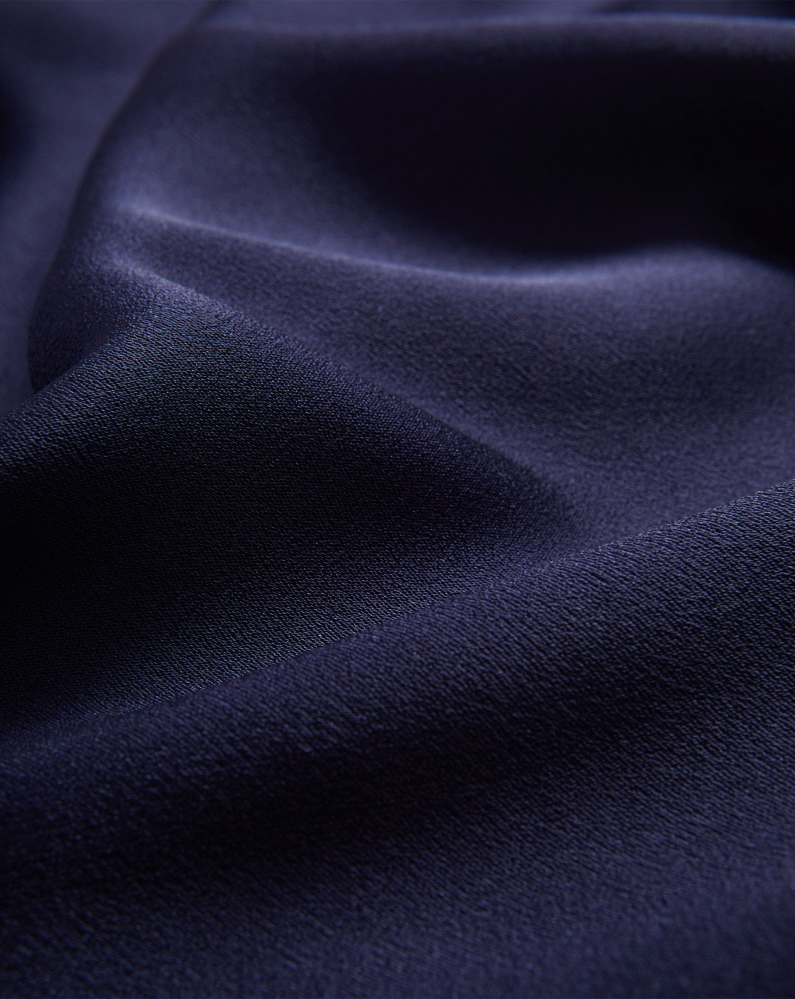 Veronica Beard Navy blue silk top, draped, with subtle sheen.
