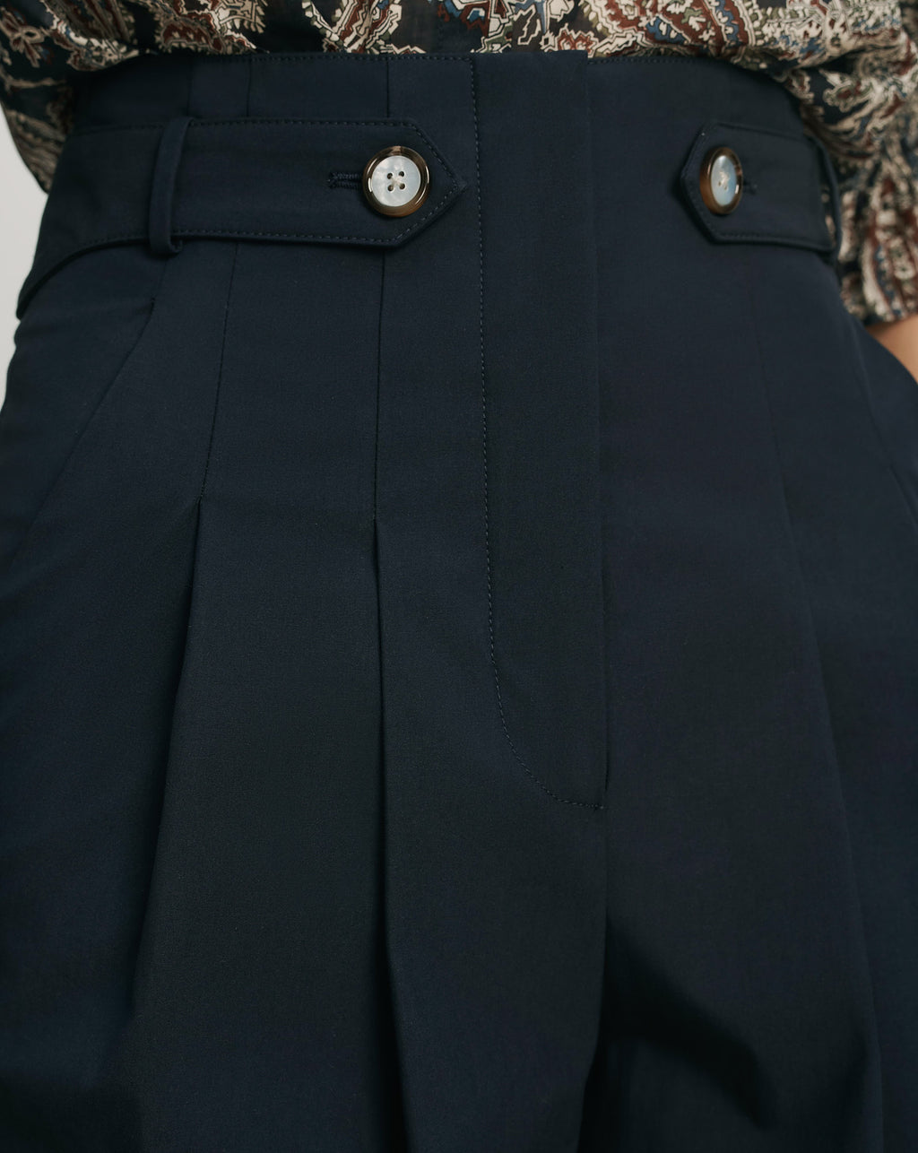Veronica Beard Navy pleated wide-leg pants with button details.