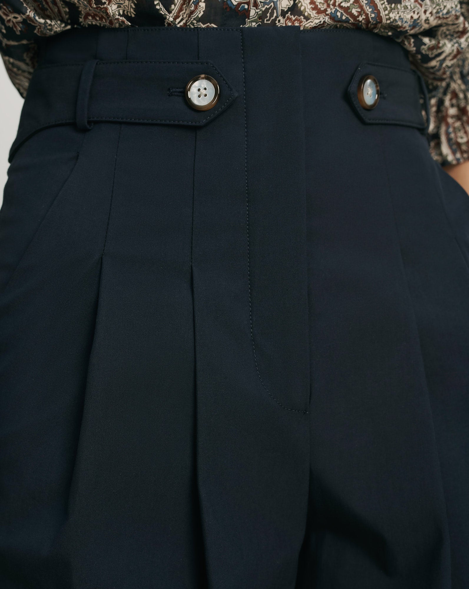 Veronica Beard Navy pleated wide-leg pants with button details.