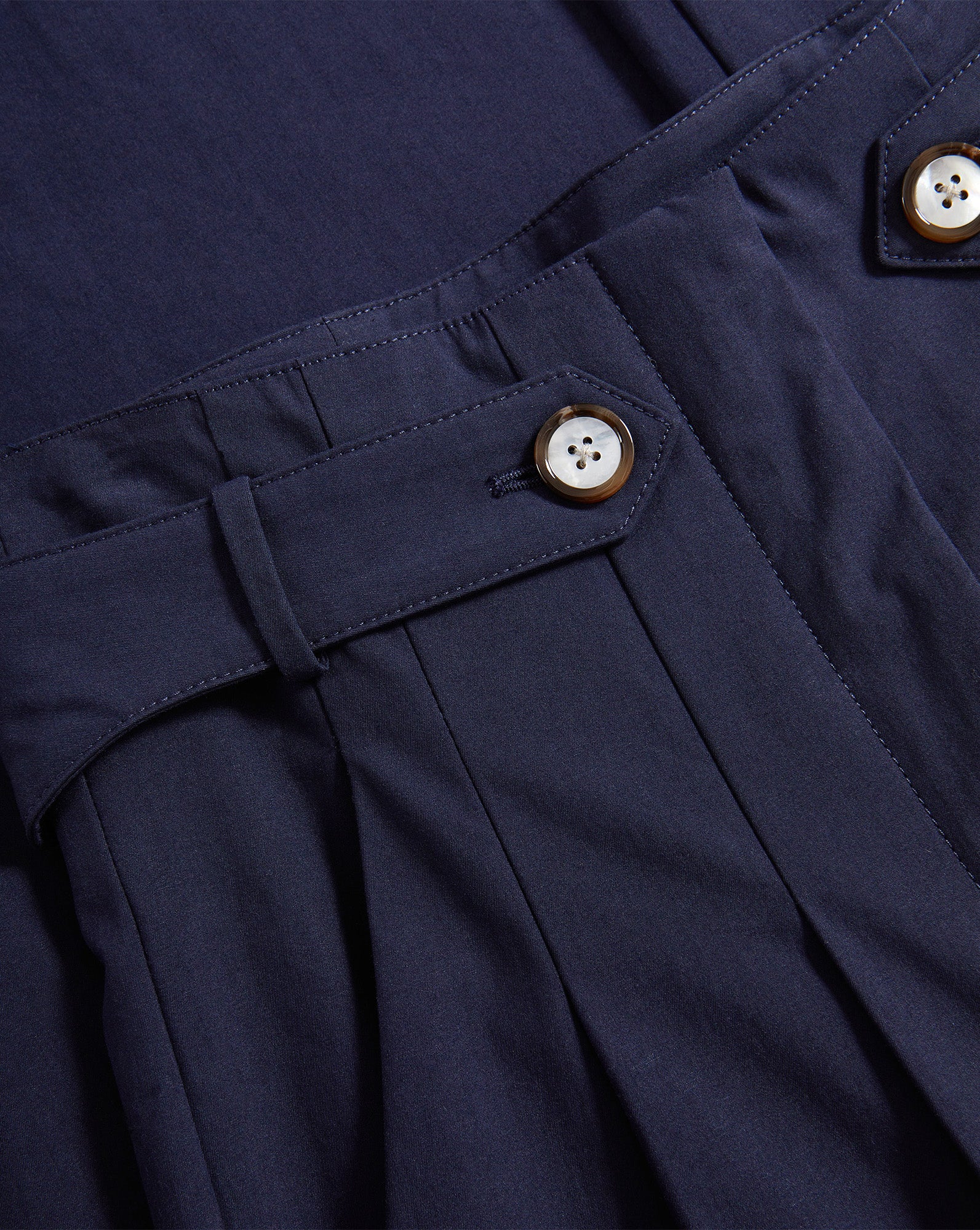 Veronica Beard Navy pleated pants with buttoned belt loops.
