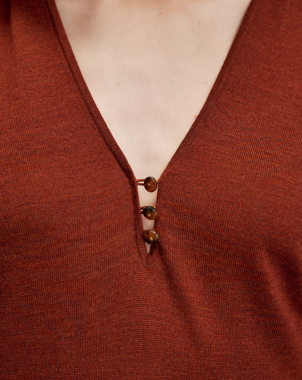 Veronica Beard Brown knit top with V-neck and three buttons.
