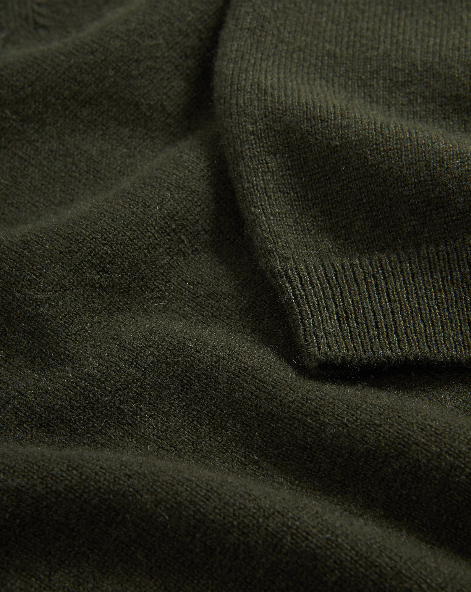 Veronica Beard Dark green knit sweater with ribbed cuff.