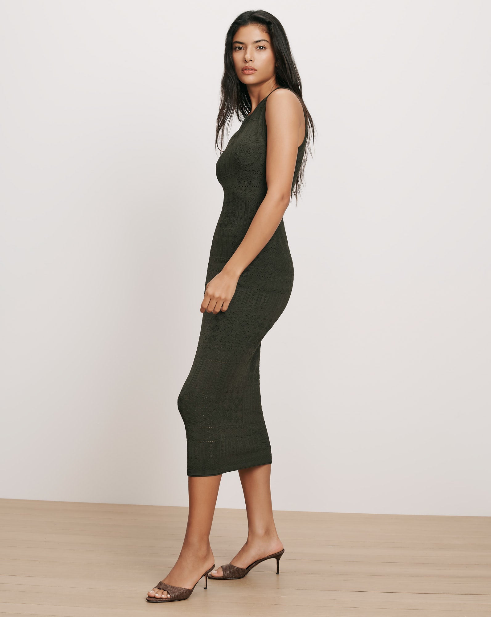 Veronica Beard Dark green knit midi dress with sleeveless design.