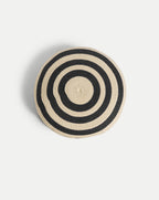 Veronica Beard Black and tan woven straw round cushion.