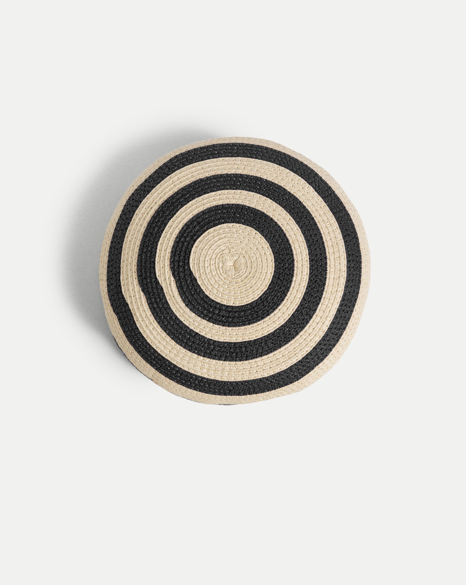Veronica Beard Black and tan woven straw round cushion.