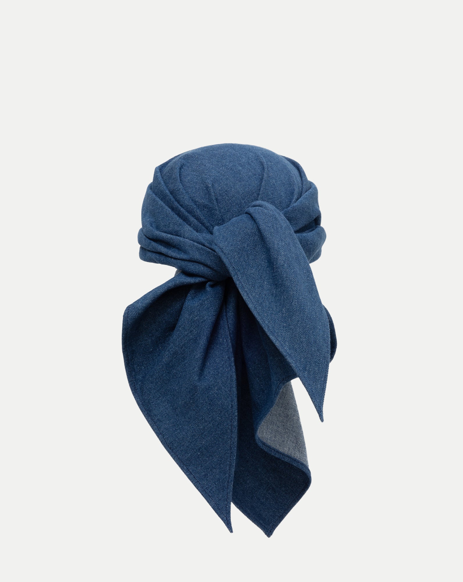 Veronica Beard Blue denim headscarf, tied in a knot.