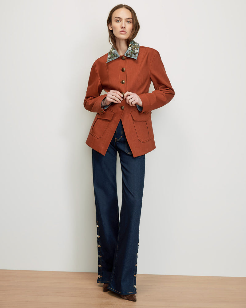 Veronica Beard Rust blazer with floral collar, dark wash jeans