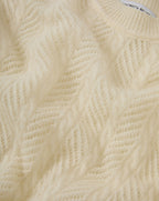 Veronica Beard Cream open-knit sweater with chevron pattern.
