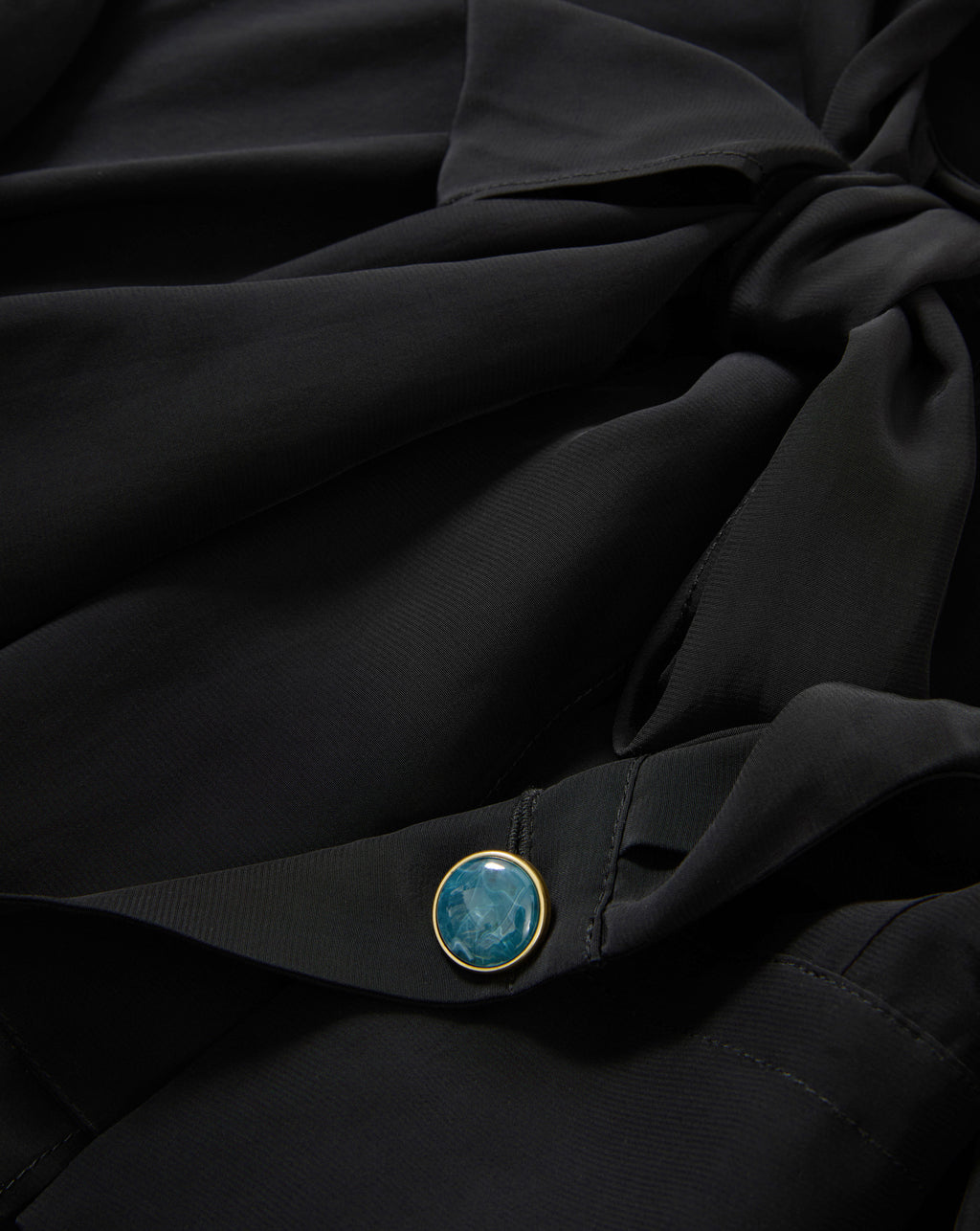 Veronica Beard Black silk blouse with teal button.