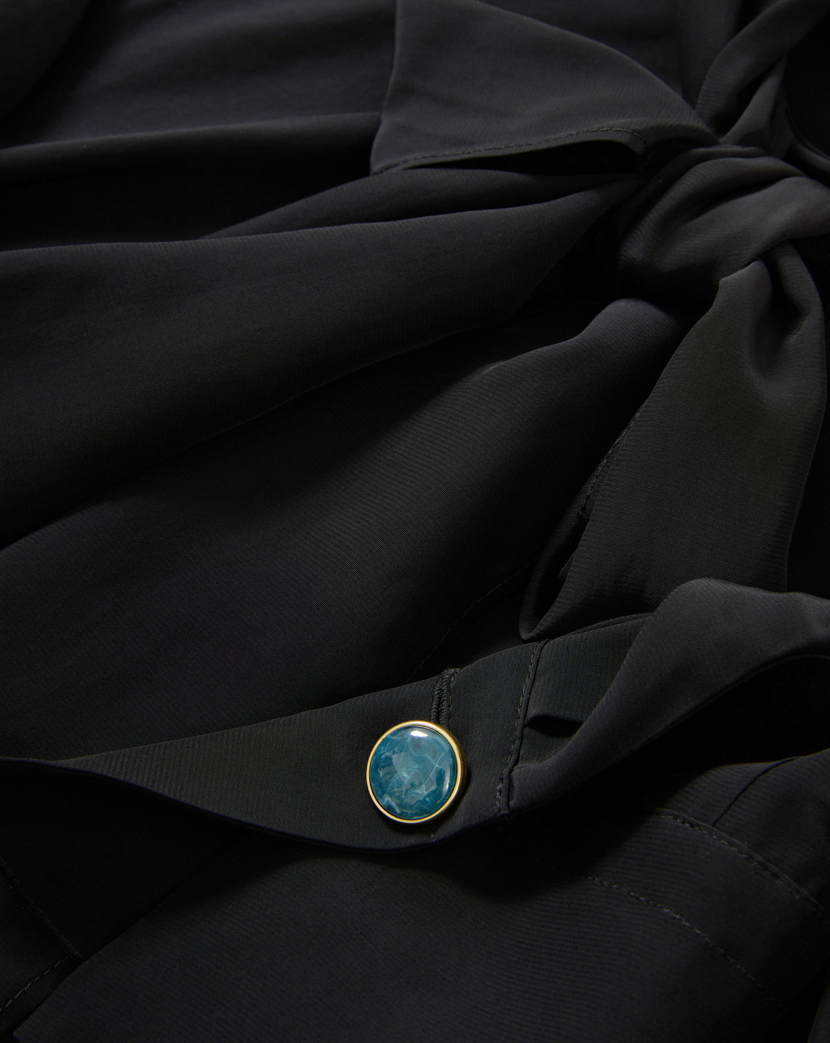 Veronica Beard Black silk blouse with teal button.