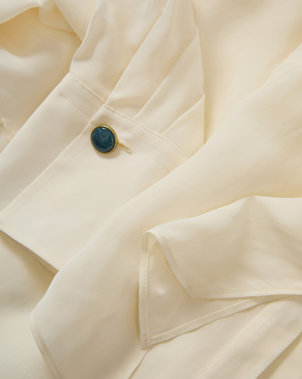 Veronica Beard Cream silk blouse, blue button cuff.