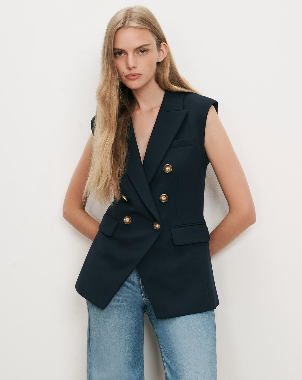 Veronica Beard Navy double-breasted sleeveless blazer with gold buttons.