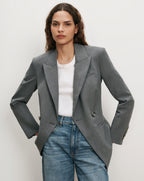 Veronica Beard Gray blazer, white t-shirt, blue jeans.