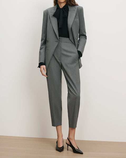Veronica Beard Gray wool suit with black blouse and slingback heels.