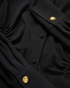Veronica Beard Black blouse with gold buttons.