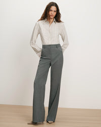 Veronica Beard Gray pinstripe shirt and gray wide-leg trousers.