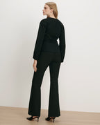 Veronica Beard Black long-sleeve top and flared pants set.