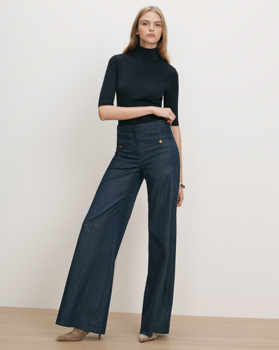 Veronica Beard Navy pinstripe wide-leg trousers with gold buttons.