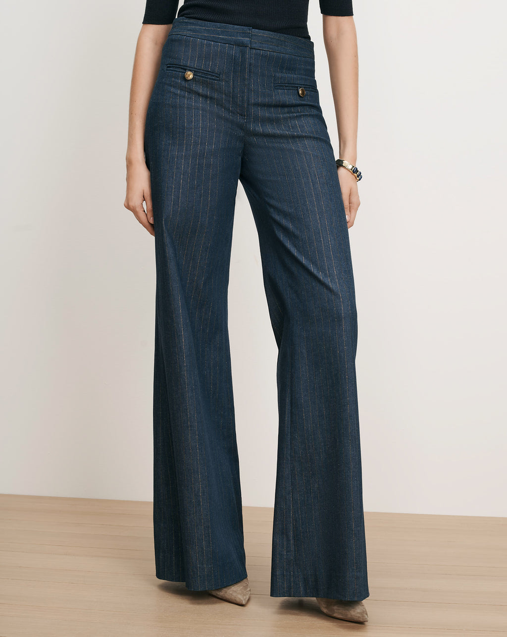 Veronica Beard Blue pinstripe wide-leg trousers with gold buttons.