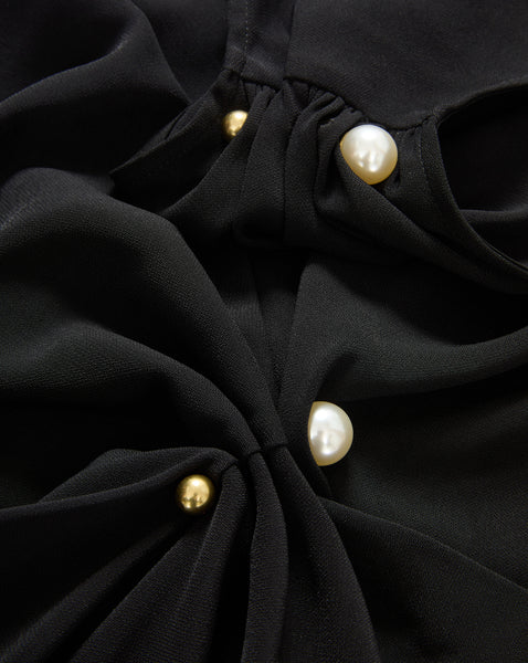 Veronica Beard Black blouse with gold and pearl buttons.