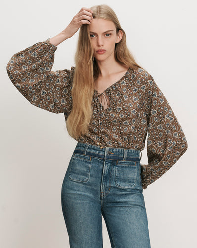 Veronica Beard Brown floral peasant blouse, blue jeans.