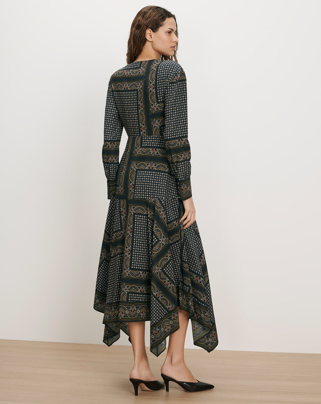 Veronica Beard Green patterned midi dress with long sleeves.