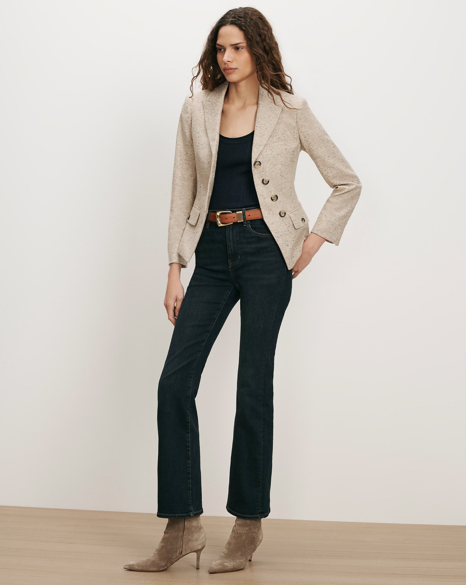 Veronica Beard Beige tweed blazer, black tank top, dark wash jeans.